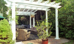 A waterfront pergola adjacent to the pool provides a cool area for family and friends.